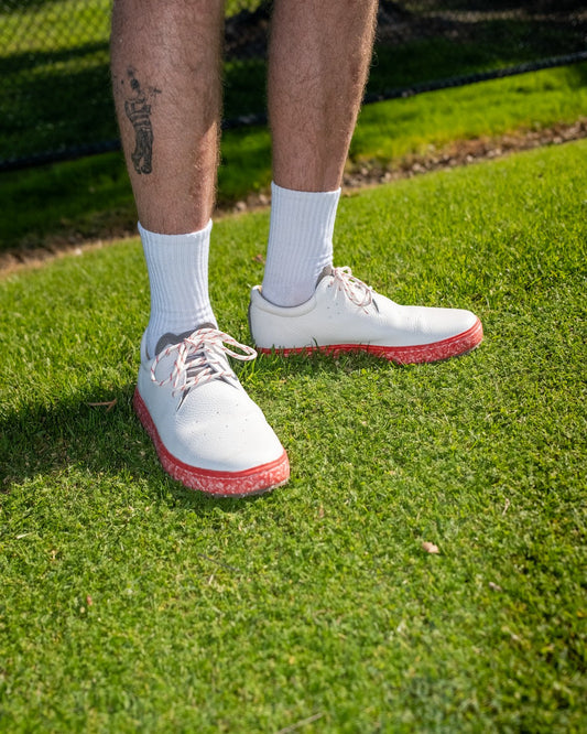 MACAW Golf on grass showing leather upper and recycled foam midsole
