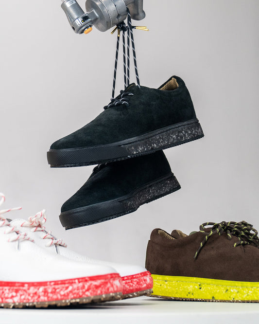 MACAW Local in black suede hanging above the white leather MACAW Golf and the brown suede MACAW Skate