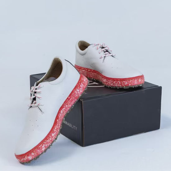 SUBTXT Golf Shoe in white premium leather with a red Blumaka recycled performance foam midsole, rotating view